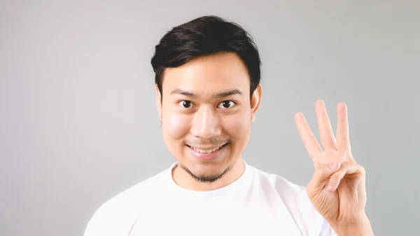 A man showing hand sign the third thing. — Stock Photo, Image