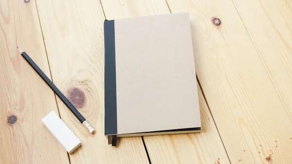 Loft workspace with stationaries on wooden table. — Stock Photo, Image