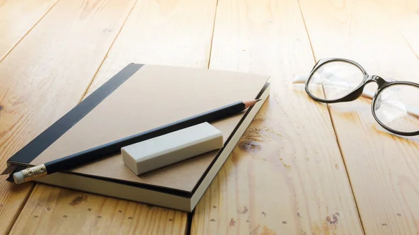 Loft workspace with stationaries on wooden table. — Stock Photo, Image