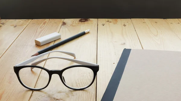 Loft workspace with stationaries on wooden table. — Stock Photo, Image