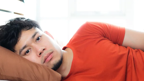 Asian man sleeping on bed. — Stock Photo, Image