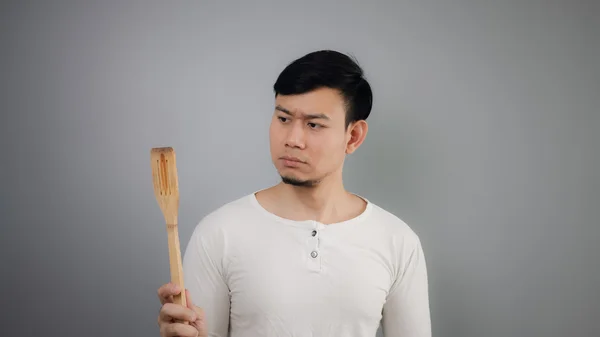 Asian man with spade of frying pan. — Stock Photo, Image