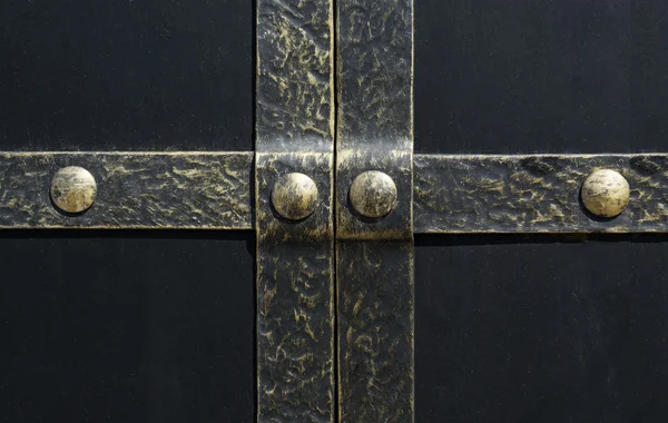 Black iron gate, brass squares and a lock with  latch — Stock Photo, Image