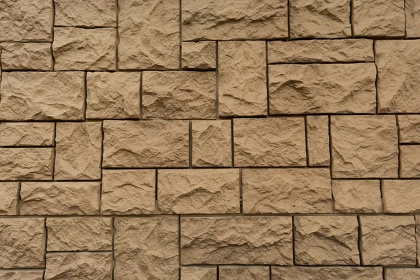 Taş, simetrik olarak kaplı tuğla duvar