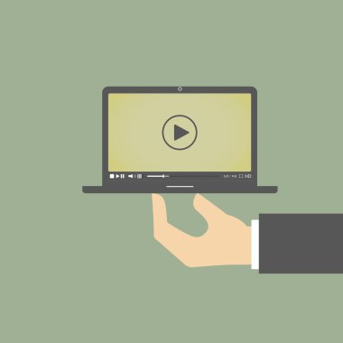 bir yandan bir video oynatıcı ile bir dizüstü bilgisayar
