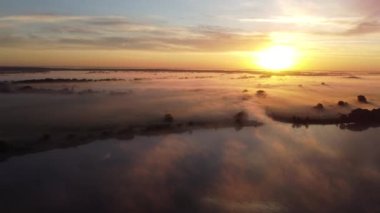 Misty summer morning over the river