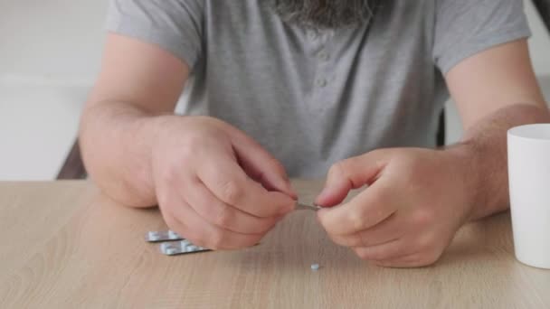 Close Man Takes Pills Leisurely Package Table — Stock Video