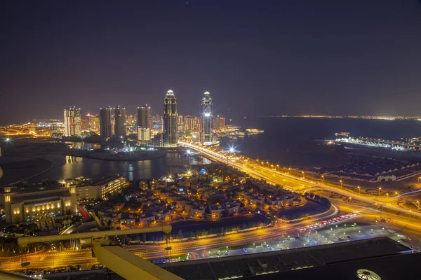 Doha, Katar - Nisan 06.2021: Doha Skyline at night time form Lusail Marina