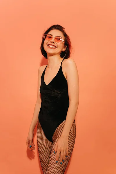 Happy Young Woman Black Bodysuit Sunglasses Posing Orange Background — Stock Photo, Image