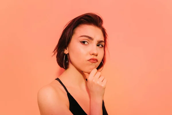 Thoughtful Young Woman Looking Away Hand Face Orange Background — Stock Photo, Image