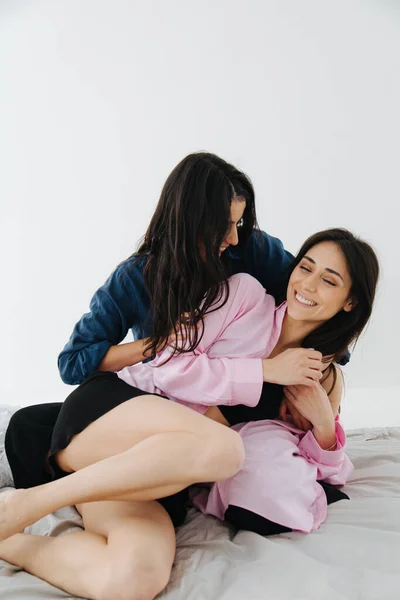 Armenian Woman Embracing Smiling Friend Bedroom — Stock Photo, Image