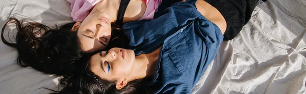 Overhead view of two young, sleeping armenian women, banner — Stock Photo