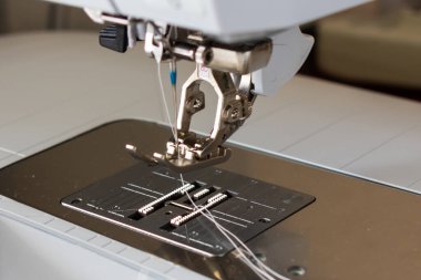 detail of a sewing machine with a needle close-up