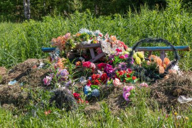 garbage of artificial flowers and funeral wreaths