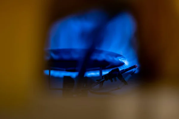 Pilot light auto igniter inside a hot water heater with flames — Stock Photo, Image