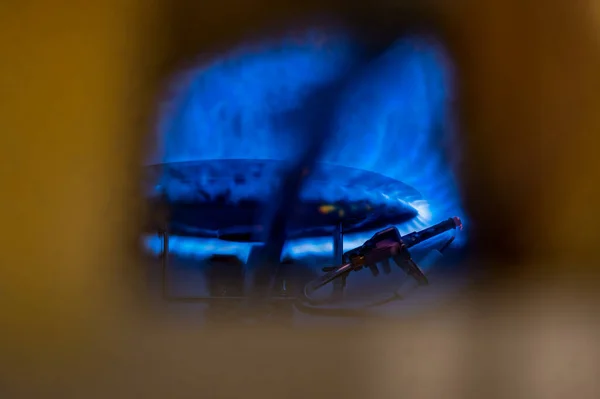 Pilot light auto igniter inside a hot water heater with flames — Stock Photo, Image