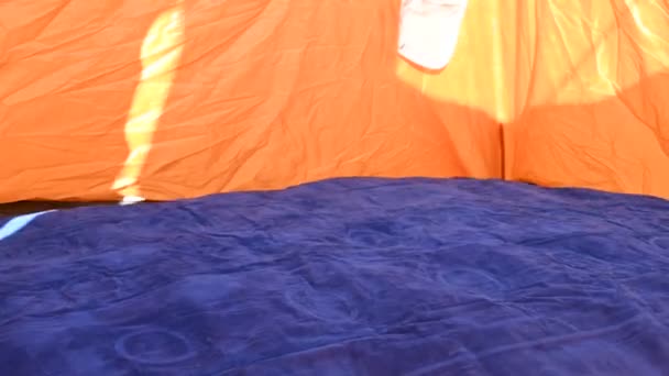 Time lapse of an inflatable air mattress being filled up inside a tent — Stock Video
