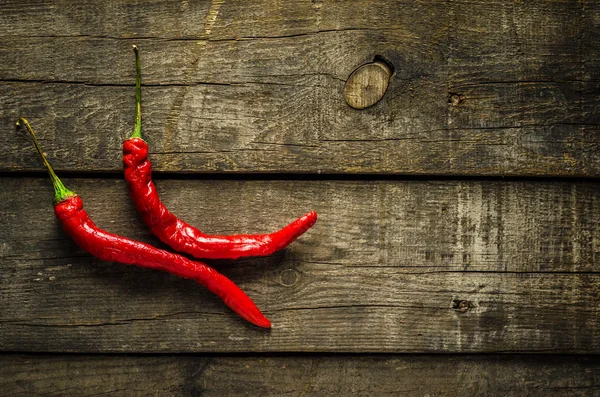 Red chilies on textured background Stok Fotoğraf