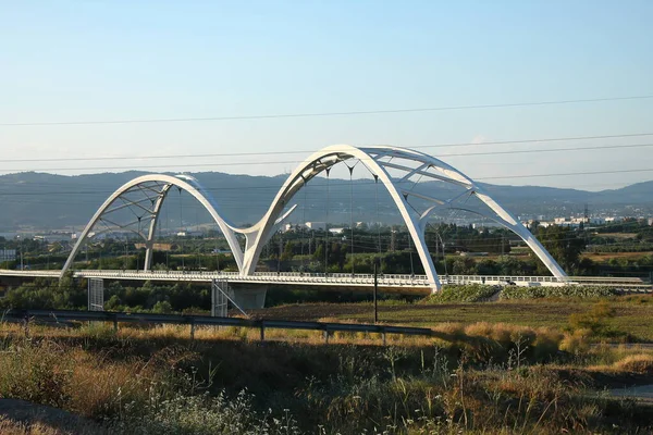 puente de arquitectura tramo ronda con sol de fondo