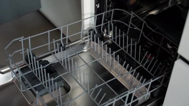 Man Putting Dirty Dishes Dishwasher Close Shot — Stock Video