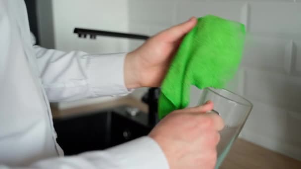 Close Shot Man Wiping Glass Cup Green Towel — Stock Video