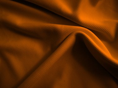 Turuncu buruşuk kumaş arkaplan. Dalgalı kumaş dokusu
