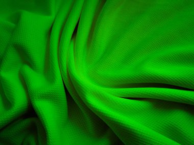 Yeşil buruşuk kumaş arka plan. Dalgalı kumaş dokusu