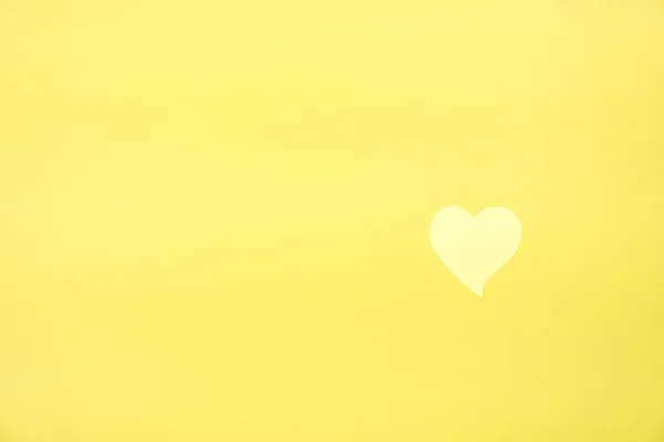 Yellow heart on yellow background — Stock Photo, Image