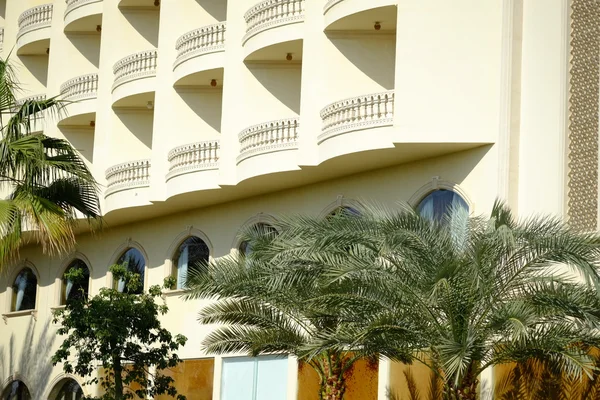 Resort architecture in Egypt. Hotel and palm trees