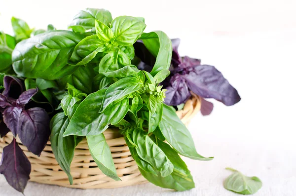 Herb leaf selection in a rustic wooden basket — Stock Photo, Image