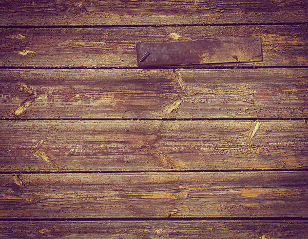 Old rusty sign with the street name