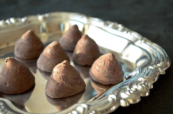 Handmade chocolate truffles on a silver tray — Stock Photo, Image