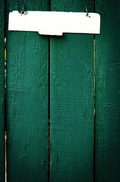 The old vintage wooden fence with metal sign — Stock Photo, Image