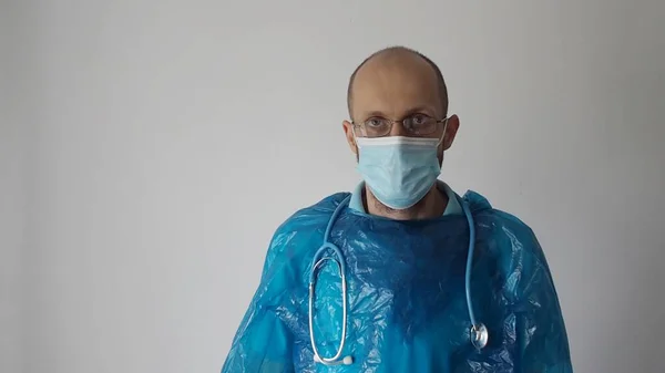 doctor in mask and uniform, puts a vaccine, coronavirus vaccine, telemedicine, doctors online
