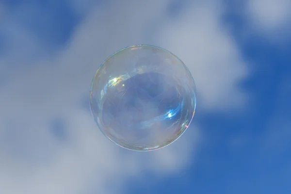 Soap bubble on blue sky — Stock Photo, Image