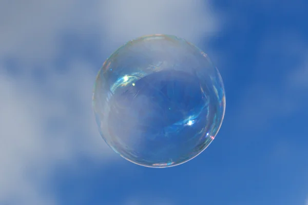 Soap bubble on blue sky — Stock Photo, Image