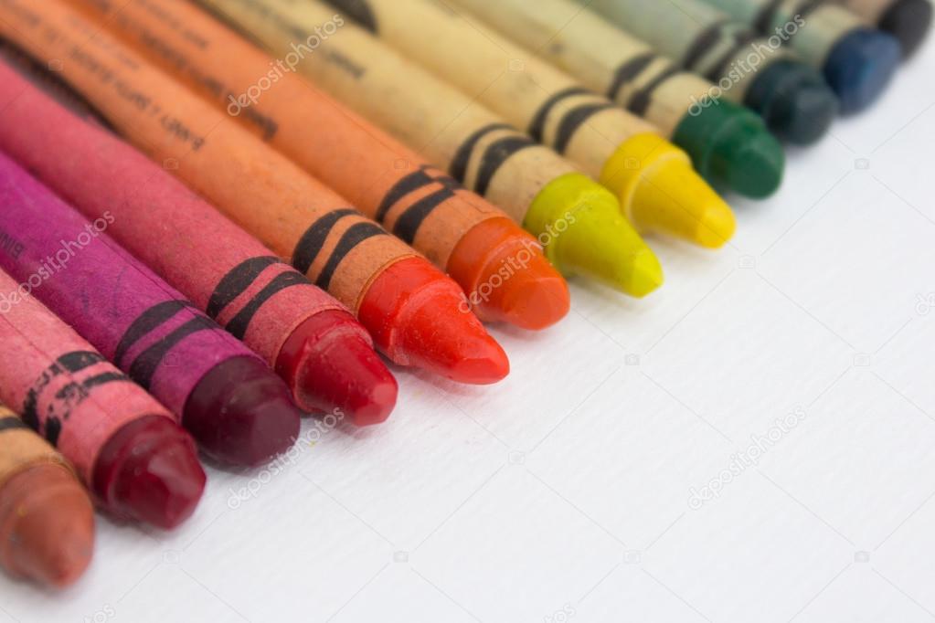 lined up crayons , color pencils closeup