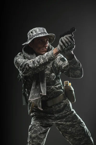 Special forces soldier man with gun on a  dark background — Stock Photo, Image