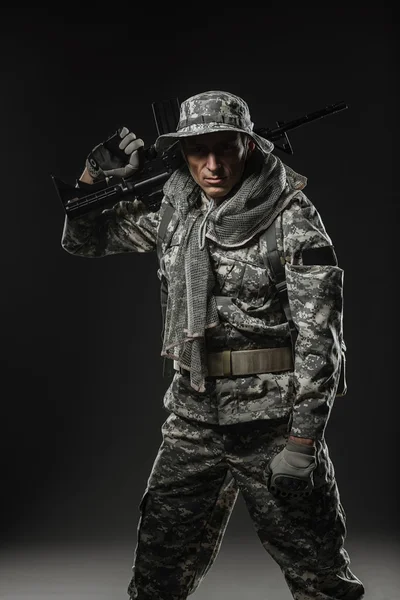 Special forces soldier man with Machine gun on a  dark background — Stock Photo, Image