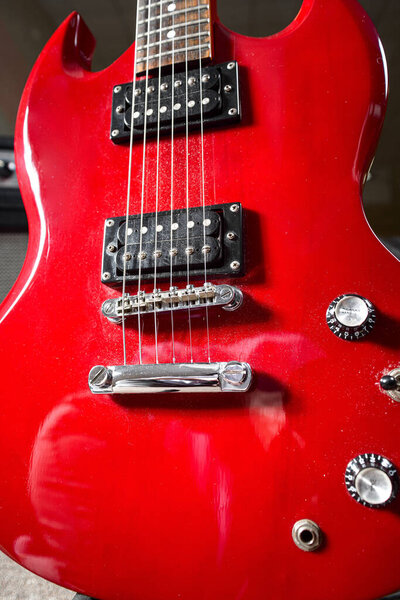 Red electric guitar, The six strings of the electric guitar are taken in close-up.