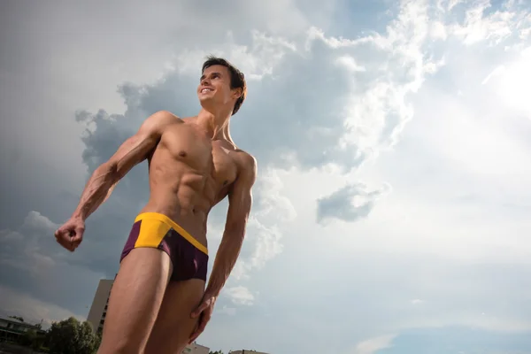 Portrait of a sporty, athletic, muscular sexy man in swimtrunks — Stock Photo, Image