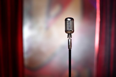 retro microphone and red curtain clipart