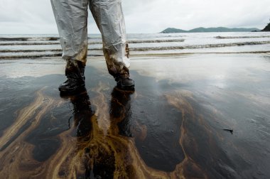 crude oil on oil spill accident on Ao Prao Beach at Samet island clipart