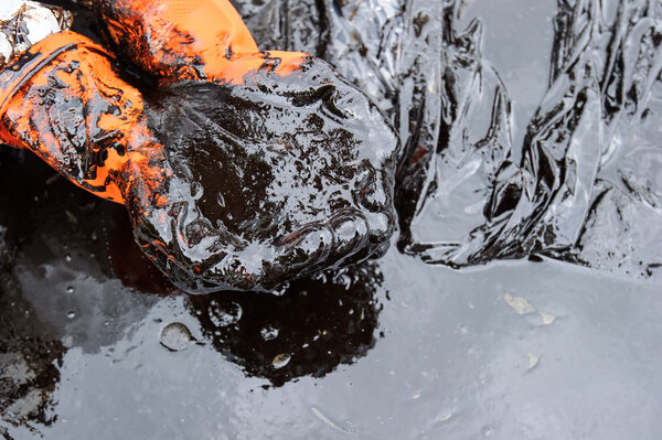 crude oil on oil spill accident on Ao Prao Beach at Samet island