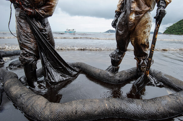 crude oil on oil spill accident on Ao Prao Beach at Samet island