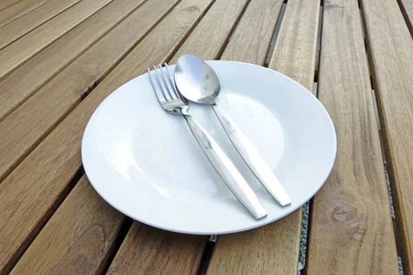 Empty White Porcelain Plate Fork Spoon Wooden Table — Stock Photo, Image