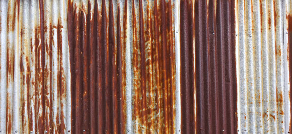 Rusty galvanized metal sheet background and texture