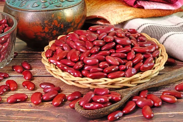 Red kidney beans in basket, selective focus. In Traditional Chinese Medicine Kidney Beans are known for tonify blood and tonify yin, help to clear heat, resolve dampness, and regulate water.
