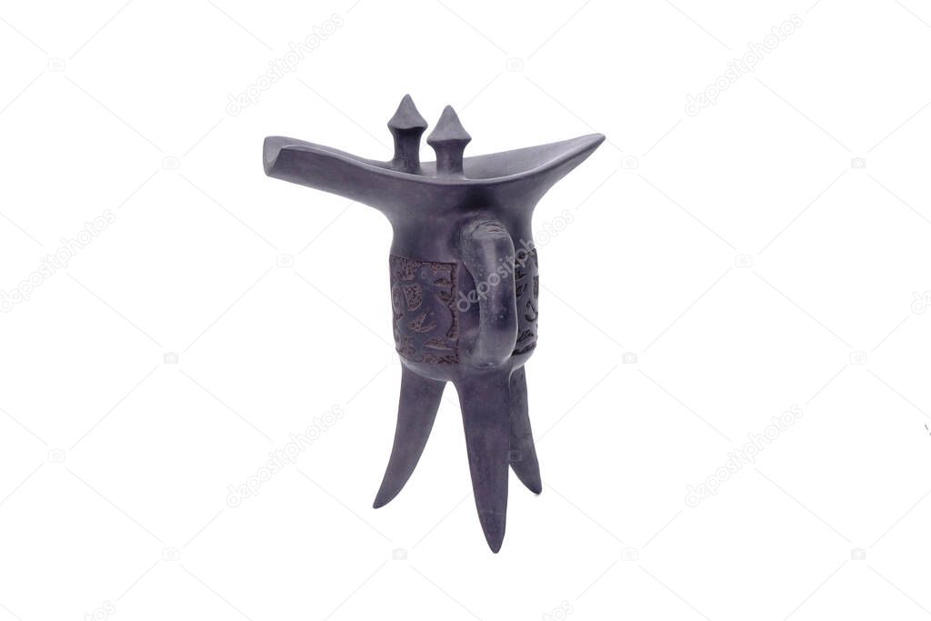 Liquor cup : Chinese Western Zhou Dynasty Tripod ritual wine vessel. (Black clay tripod vessel) isolated on white background