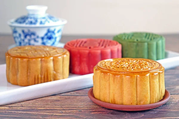 A mooncake is a Chinese bakery product traditionally eaten during the Mid-Autumn Festival. The festival is for lunar appreciation and moon watching. Selective focus,blurred background with copy space